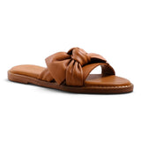 Step Ahead Pesso Bella tan leather slide sandals featuring a decorative knotted bow detail on the strap