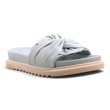 Step Ahead Pesso Borgan Aqua slide sandals in light blue leather with a knotted strap and textured beige sole