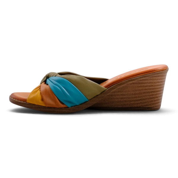 Step Ahead Pesso Tarin wedge sandals featuring a multi-colored knotted leather strap in yellow, blue, and olive.