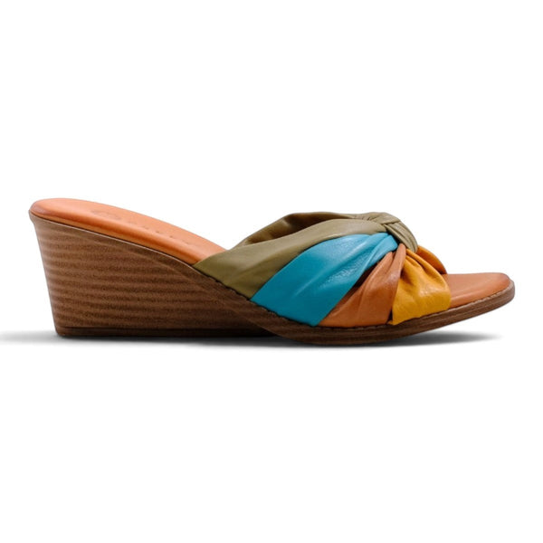Step Ahead Pesso Tarin wedge sandals featuring a multi-colored knotted leather strap in yellow, blue, and olive.